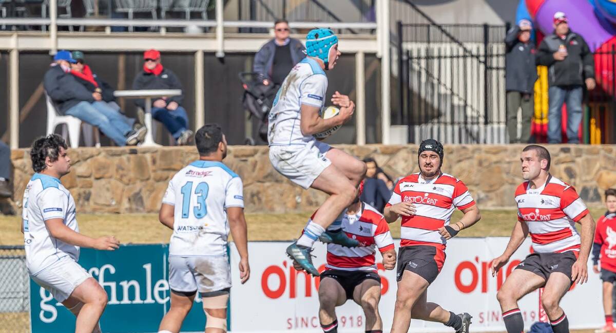 Airborne: The grand final match was tight until the last few minutes, which blew out in favour of the Queanbeyan Whites. Photo: Tuggeranong Vikings. 