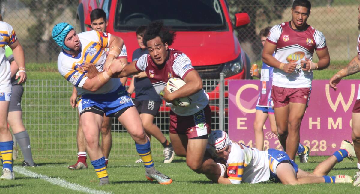 Tripped up: Queanbeyan's Eli Sinoti is tackled by two Goulburn opponents in the course of the Bulldogs' 34-14 win over the Roos on Sunday afternoon at the Goulburn Workers Arena. Photo: Zac Lowe.