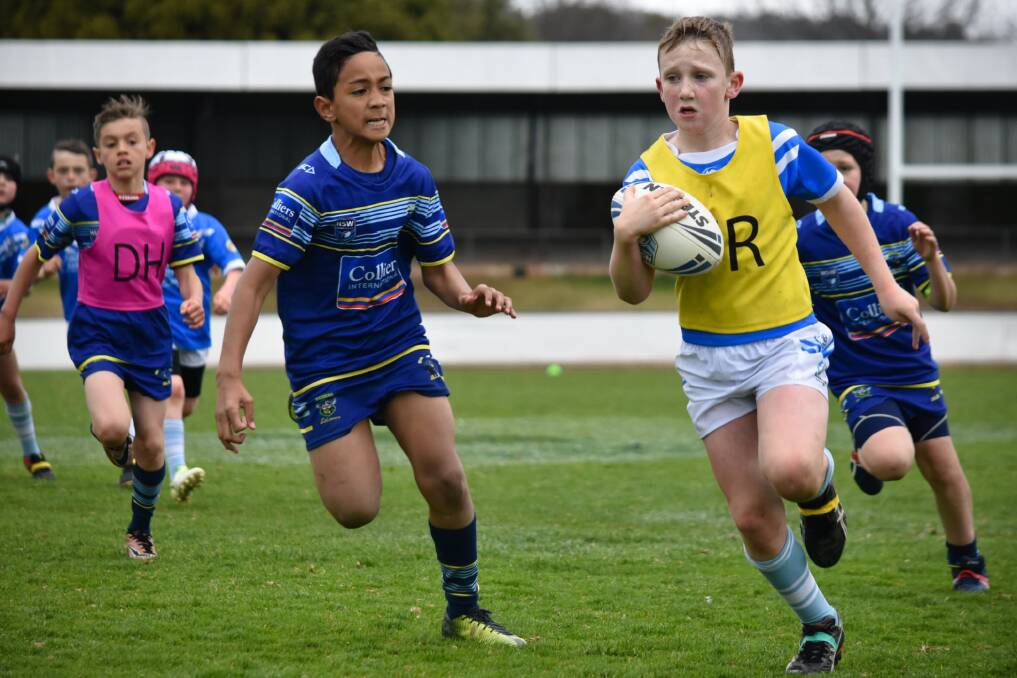 Run hard: The Under 10's were smaller than their West Belconnen opponents and beset by injuries, but they fought incredibly hard to salvage a draw. Photo: Canberra Region Rugby League. 
