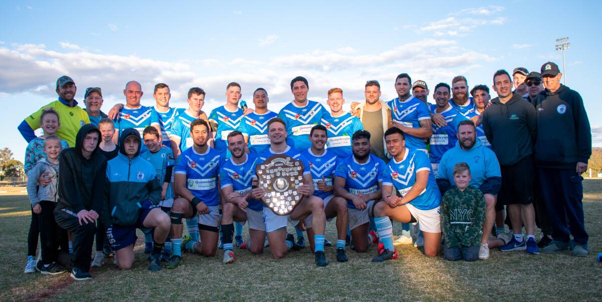 Minor premiers: The Queanbeyan Blues pose with the plate after defeating the Tuggeranong Bushrangers last weekend. Photo: Canberra Region Rugby League.