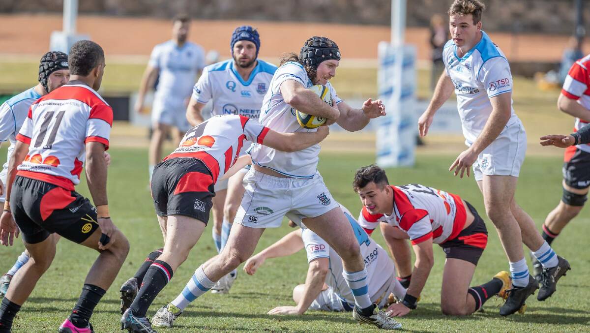 Sidestep: The Whites managed to avoid defeat thanks to a last-minute try, which also secured them a place in the grand final. Photo: Tuggeranong Vikings. 