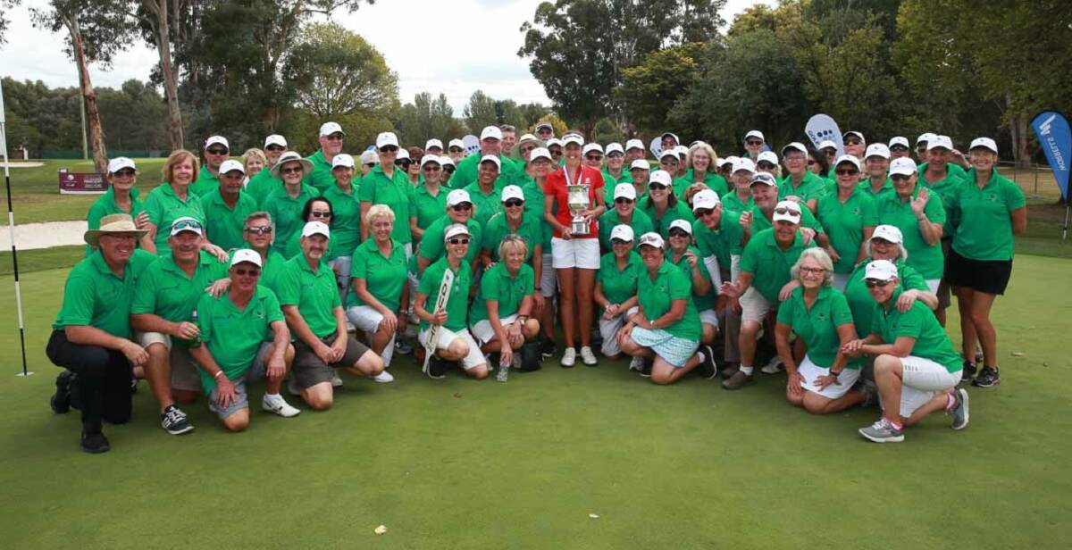 Winner in red: Meghan MacLaren (centre, in red) surrounded by volunteers from the Queanbeyan Golf Club following her victory in the NSW Women's Open. Photo: Golf NSW.