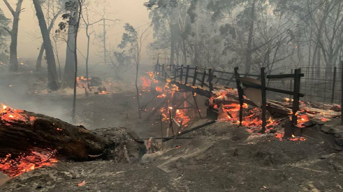 FOOTBRIDGE: This pic taken by the Carwoola RFS shows the old wooden footbridge just before the village of Nerriga. It was lost in the fires.