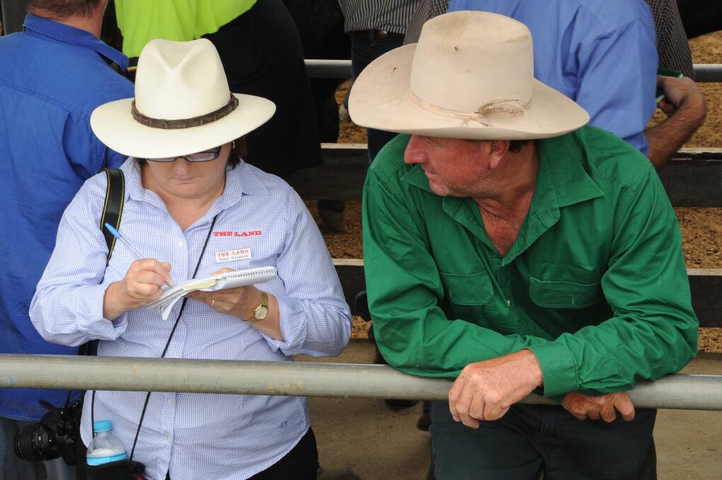 ON THE TOOLS: Robyn Ainsworth chats to old mate at Wodonga Weaner Sales.