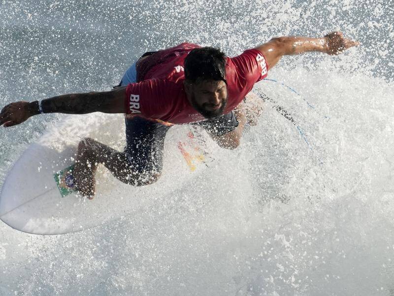 Brazil's Italo Ferreira has won the first heat as surfing made its Olympic debut in Japan.