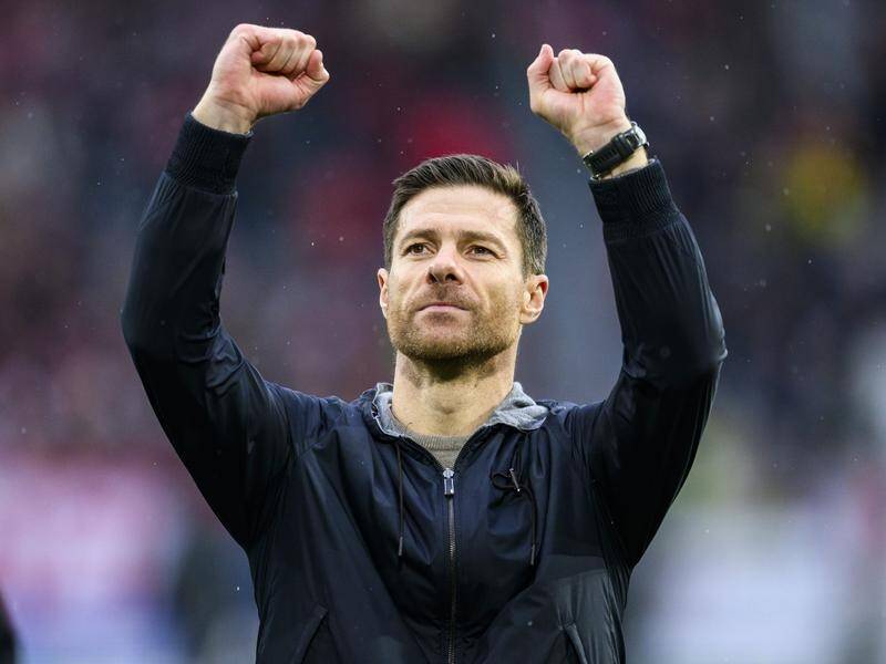 Coach Xabi Alonso celebrates another triumph for his unstoppable Bayer Leverkusen side. (AP PHOTO)