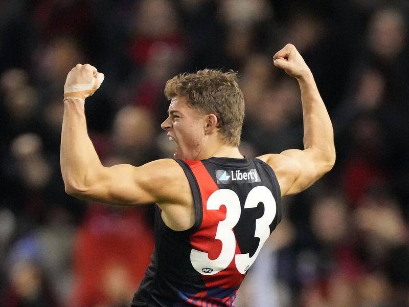Brayden Ham celebrates kicking the final goal as Essendon beat Fremantle by seven points in the AFL.