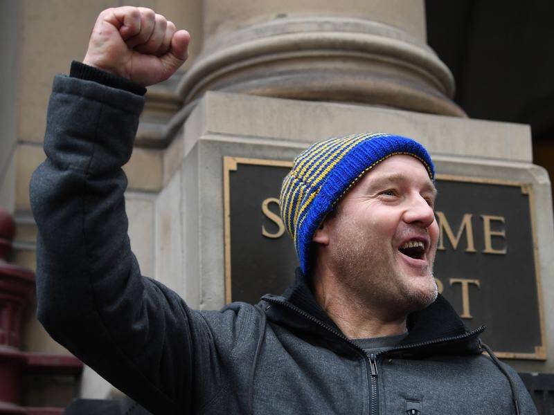 Abuse survivor Robert House cheers after hearing George Pell will remain in prison.