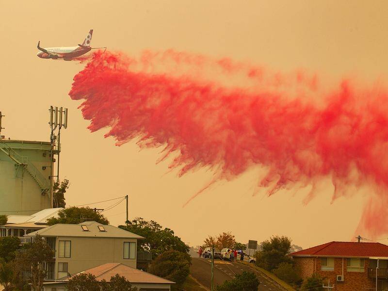 A water bombing plane was diverted to drop retardant on a bushfire in Sydney's upper north shore.