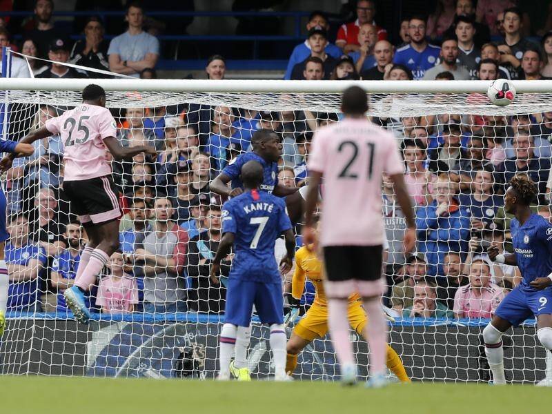 Wilfred Ndidi (2nd left) leaps high to head home Leicester's equaliser at Chelsea.