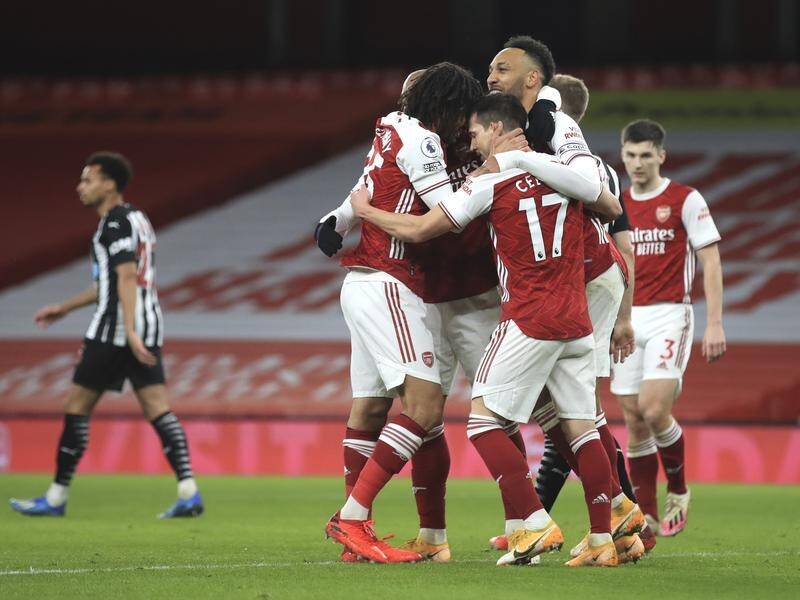 Arsenal's Pierre-Emerick Aubameyang (c) has celebrated two goals in their win over Newcastle United.