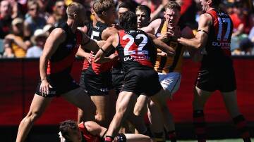 Hawthorn's James Sicily (2nd r), seen here scuffling with Essendon players, has avoided suspension. (James Ross/AAP PHOTOS)