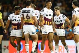 Brisbane's Reece Walsh (second right) suffered cramp during the Broncos' win over Wests Tigers. (Brett Costello/AAP PHOTOS)