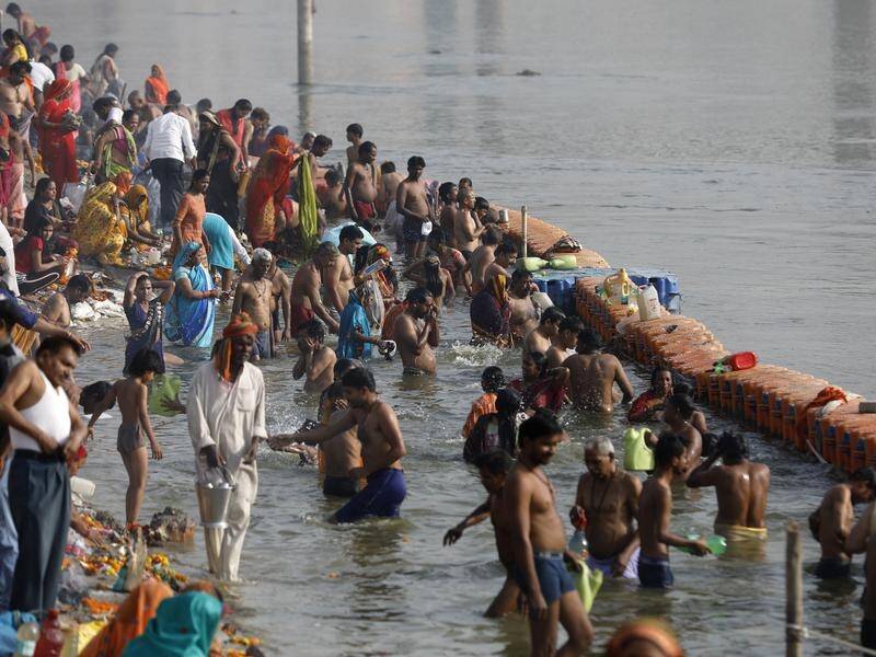 Hindus in India are gathering in huge numbers on the Ganges as the county's coronavirus cases rise.