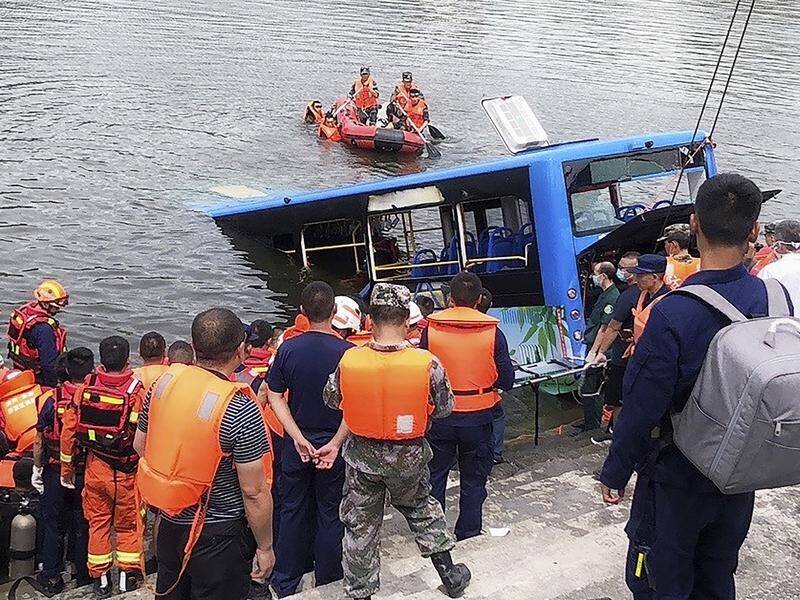More than 20 people were killed when a bus plunged into a lake in southwestern China.