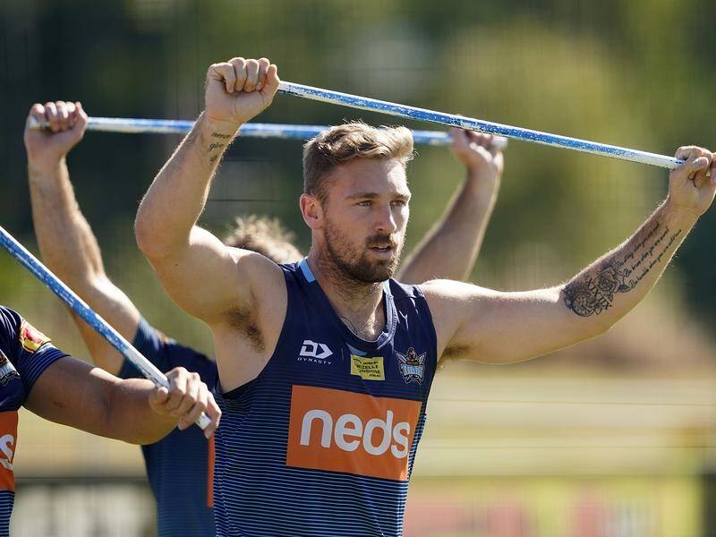 Bryce Cartwright has shone on return to Gold Coast NRL training after his anti-flu vaccine stance.