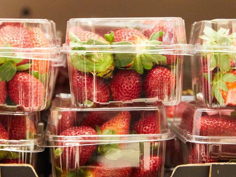 Police and health authorities are investigating after sewing needles were found inside strawberries.