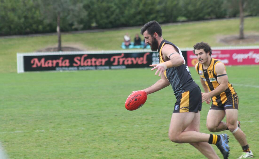 Queanbeyan Tigers AFL Canberra 1st grade player Mitchell Gorman gets a kick away during his side's 47 point win over the Tuggeranong Hawks at Dairy Farmers Park. Photo: Joshua Matic.