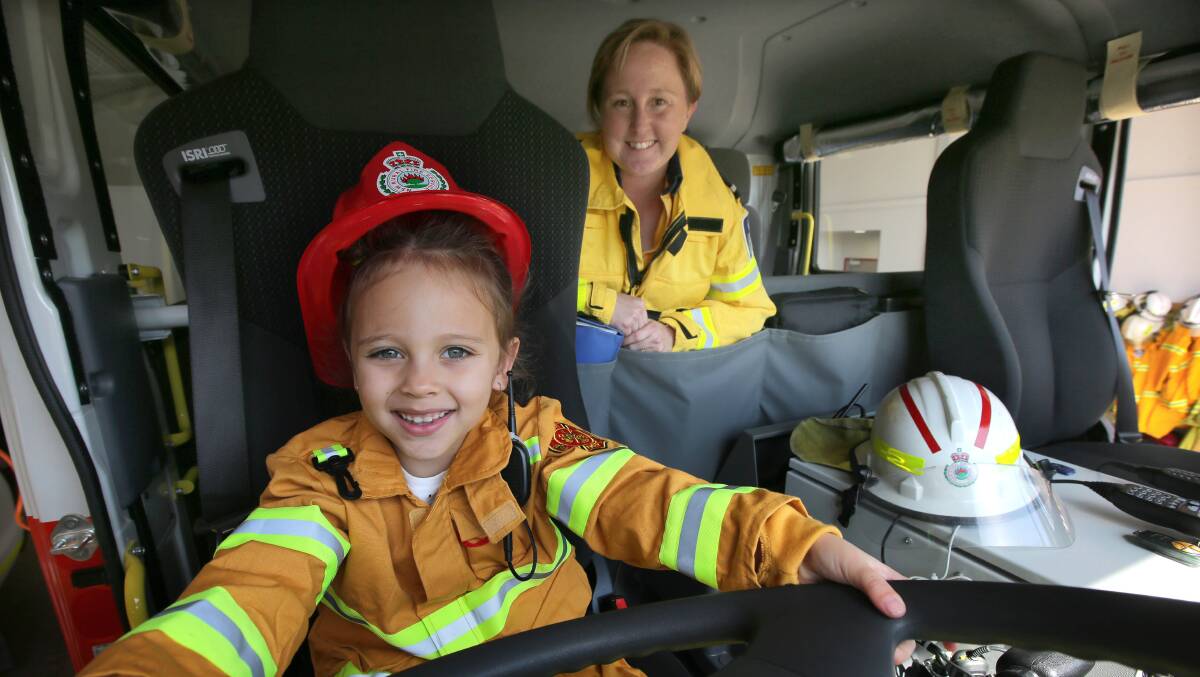 NSW Rural Fire Service hosts Get Ready Weekend. Five year old Kiarni Davidson and dept cpt Deb Sharp at Engadine RFS. Picture: John Veage