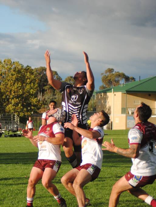 Leap: This high fly was one of the few highlights from the Yass Magpies during the match. Photo: Burney Wong. 