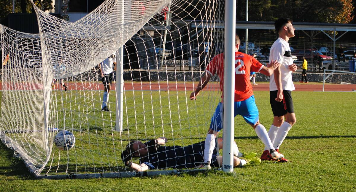 Goal: Queanbeyan City FC weren't able to keep the goal out from the White Eagle's Milan Santrac. Photos: Burney Wong. 