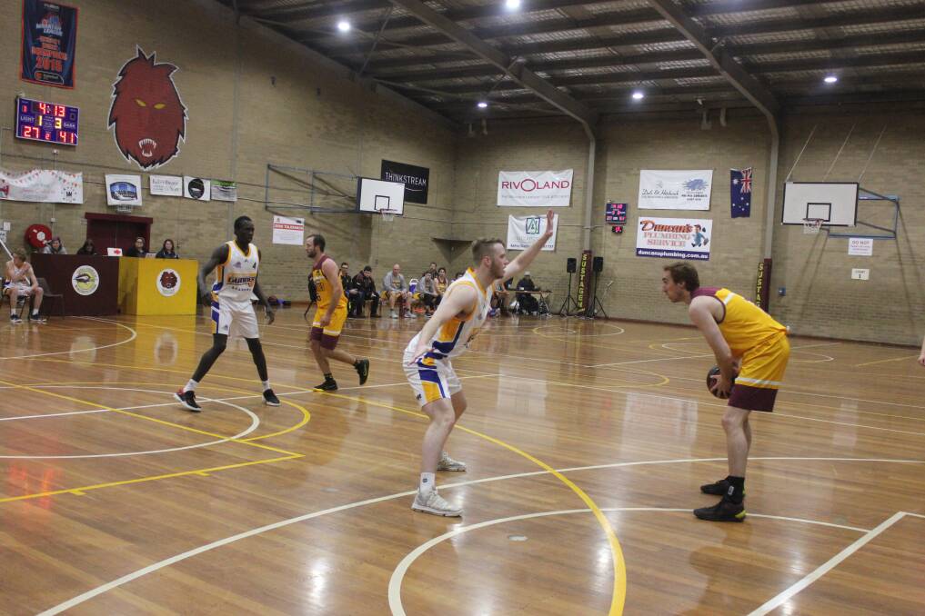 One on one: There are plenty of things to work on for the Queanbeyan Yowies after their loss to the Canberra Gunners Academy. Photo: Burney Wong. 