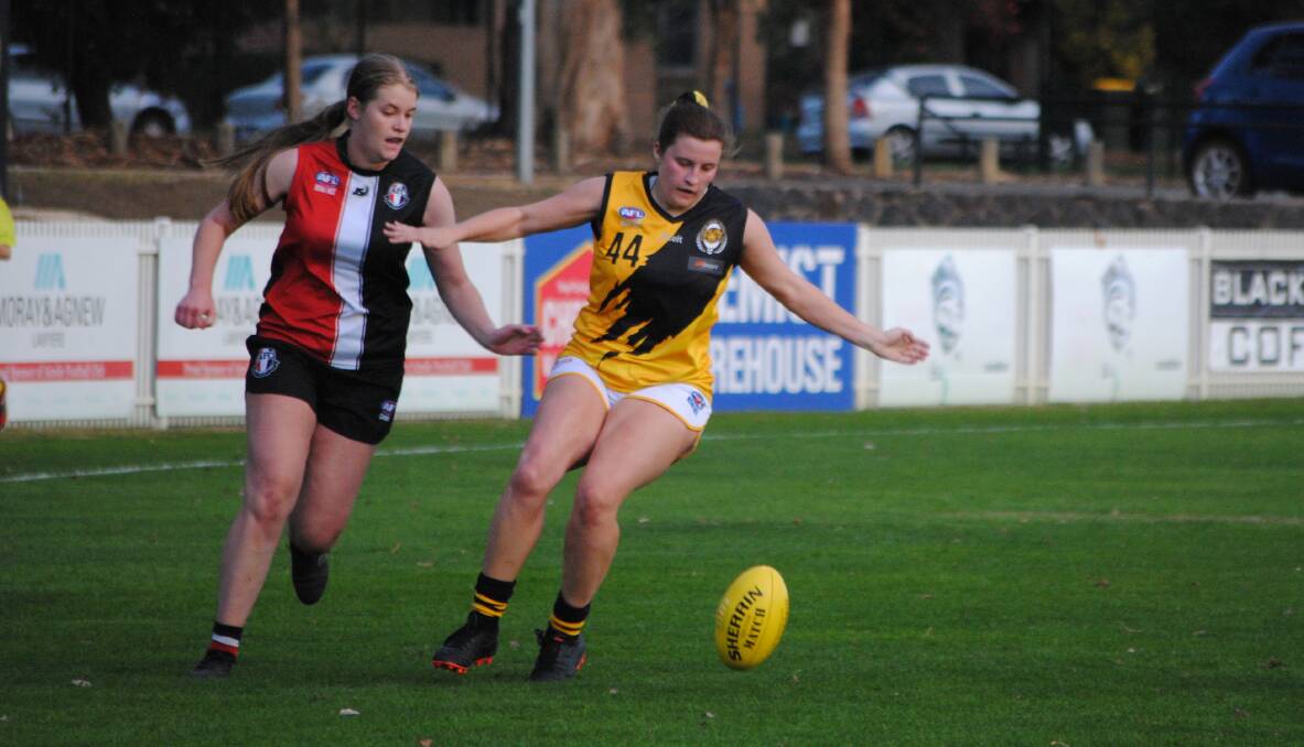 Tussle: It was a tight first quarter, but the Queanbeyan Tigers women side were too good for Ainslie in the end. Photo: Burney Wong. 