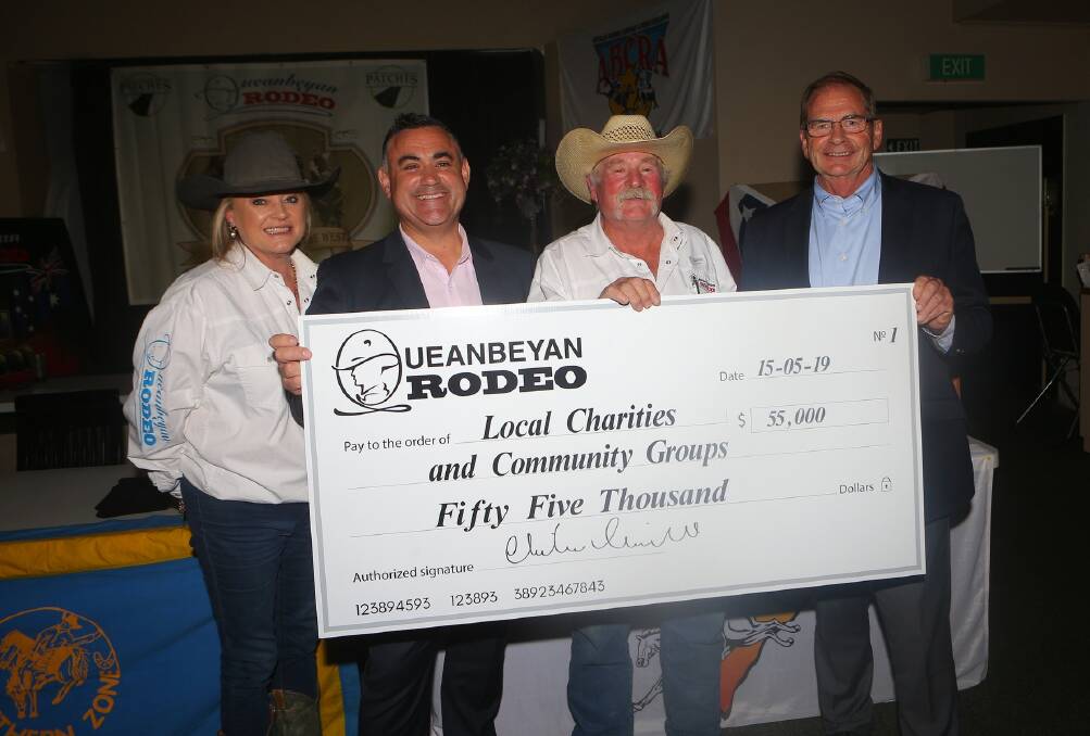 Presentation: Queanbeyan Rodeo secretary Christine Corkhill, NSW deputy premier John Barilaro, Queanbeyan Rodeo president Mark Mills and Queanbeyan mayor Tim Overall with the cheque to local charities and community groups. Photo: supplied. 