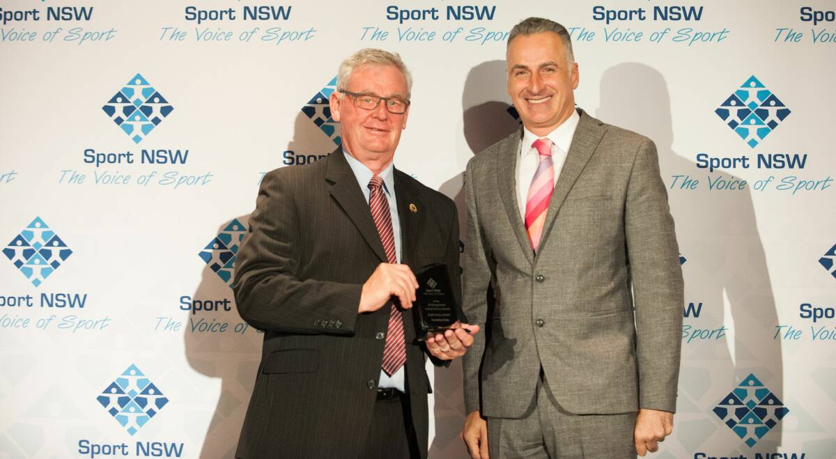 Achievement: Distinguished long service award recipient Gary Bullivant with sports minister John Sidoti at the NSW Community Sports Awards. Photo supplied. 