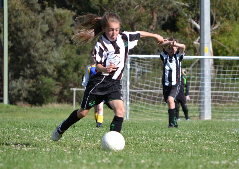 Karly playing at the U10s level. 