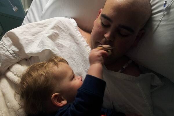 Mr Maria with his one-year-old son during his first round of chemotherapy.