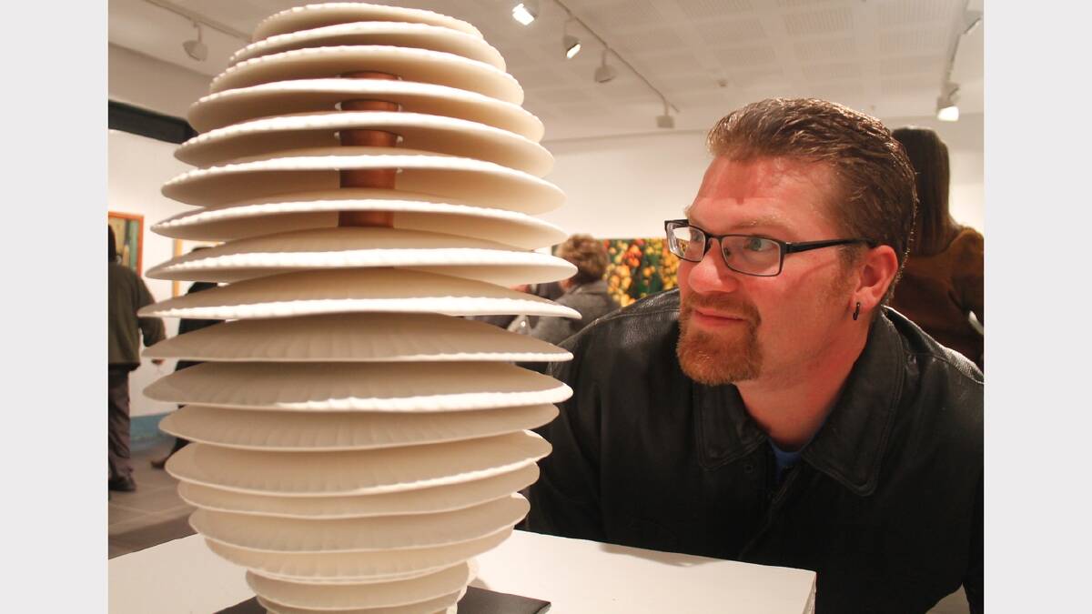 Ceramic artist Chris Harman with his sculpture.